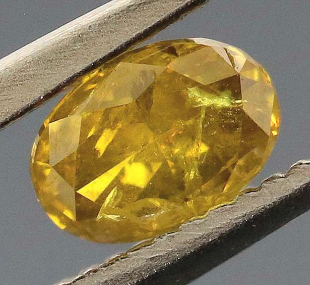 Eye catching .24ct oval cut golden Diamond