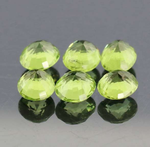 Dazzling 6.78ct untreated apple green Peridot set