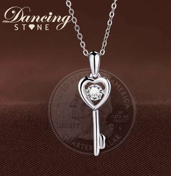 Elegant heart key pendant with center Stone dancing