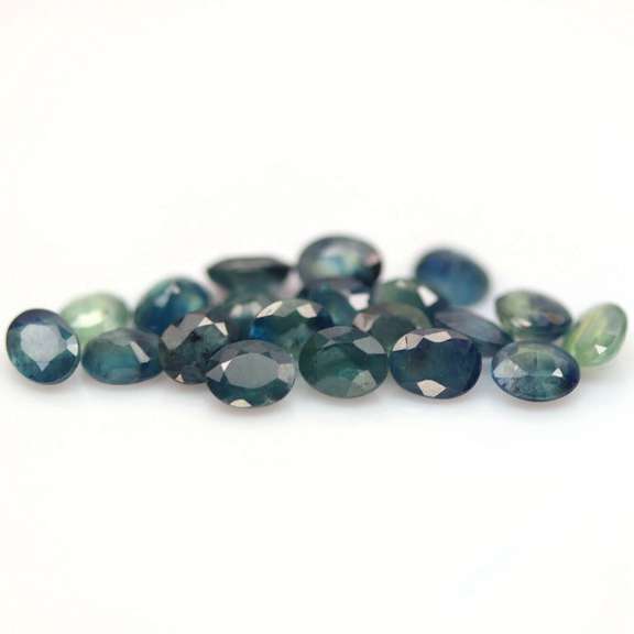 Heated only! 9.56ct blue green Sapphire set