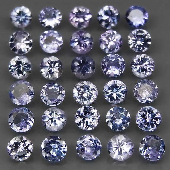 Heavy flashing 5.20ct diamond cut Tanzanite set