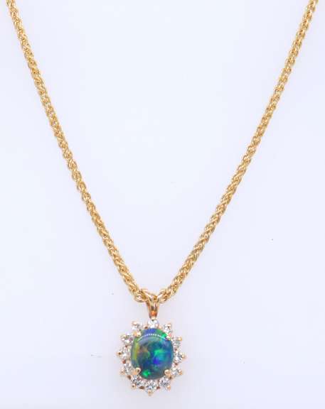 Pleasing Yellow Gold Oval Opal and Diamond Pendant on Wheat Chain