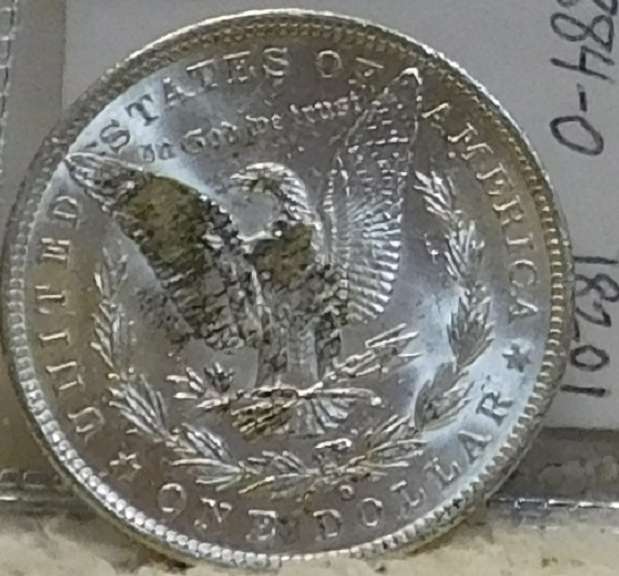 1884-O Morgan Dol near near Unc, strike thru