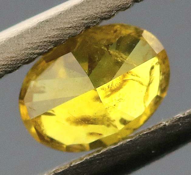 Eye catching .24ct oval cut golden Diamond