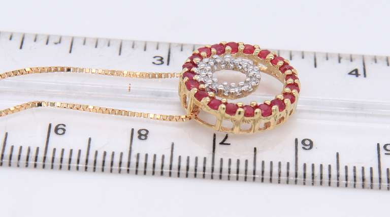 Attractive Yellow Gold Double Circle Ruby and Diamond Pendant on Chain