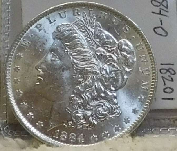 1884-O Morgan Dol near near Unc, strike thru
