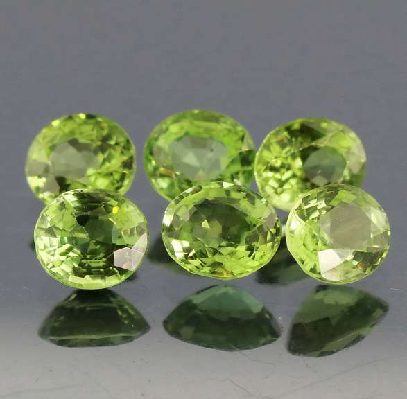 Dazzling 6.78ct untreated apple green Peridot set