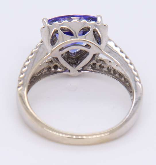 Powerful White Gold Trillion Cut Tanzanite and Diamond Halo Ring