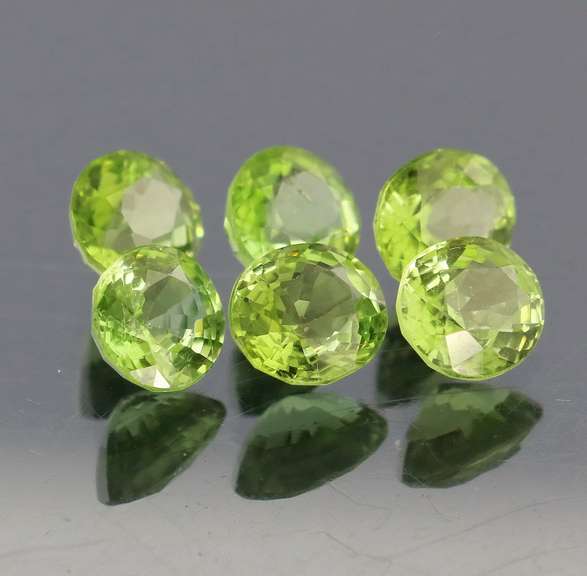 Dazzling 6.78ct untreated apple green Peridot set