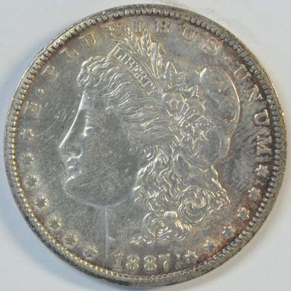 Lustrous original AU 1887-S Morgan Silver Dollar. Better date