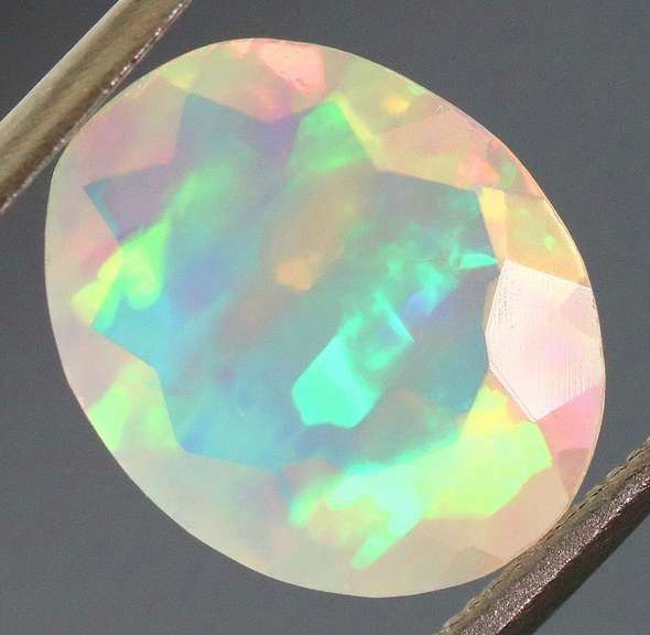 Captivating 1.70ct fully faceted fairy fire jelly Opal