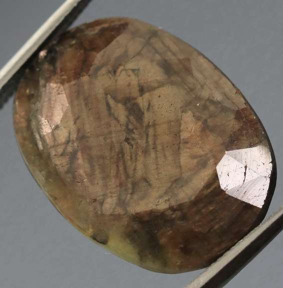 Shimmering metallic 15.85ct earth toned faceted Sapphire