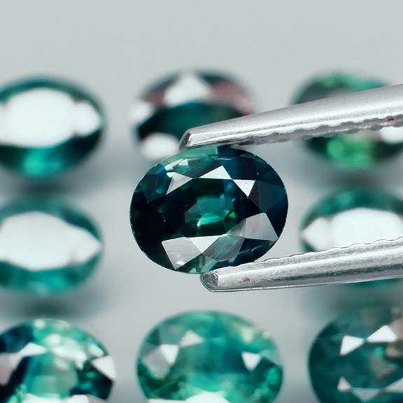 Heated only! 6.25ct blue green sapphire set