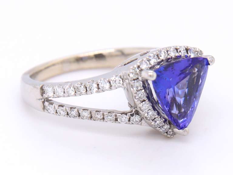 Powerful White Gold Trillion Cut Tanzanite and Diamond Halo Ring