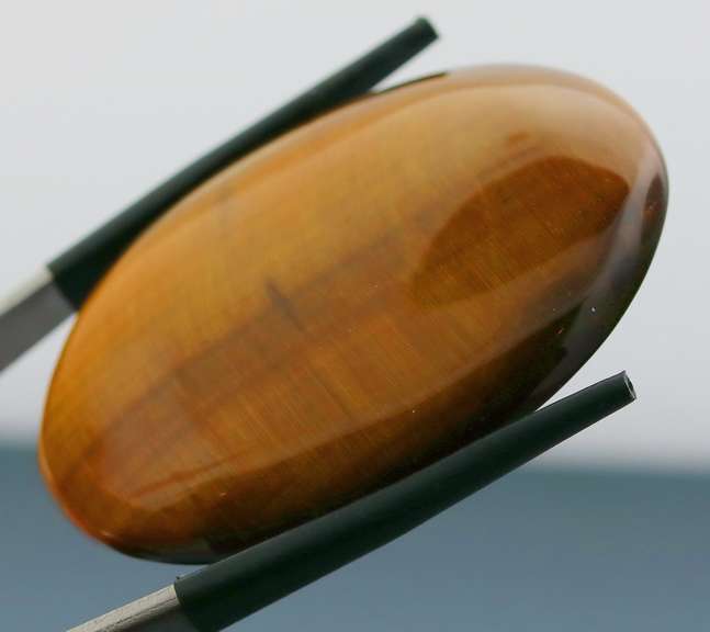 Full body shimmer! 75.44ct Golden Tiger Eye cabochon