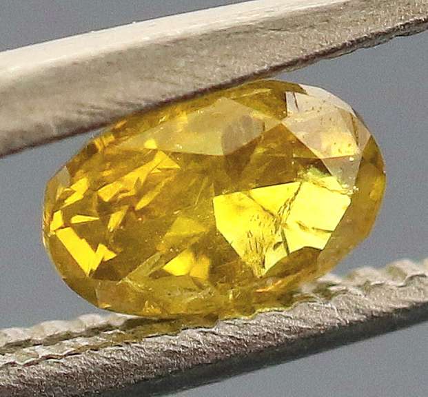 Eye catching .24ct oval cut golden Diamond