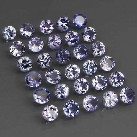 Heavy flashing 5.20ct diamond cut Tanzanite set