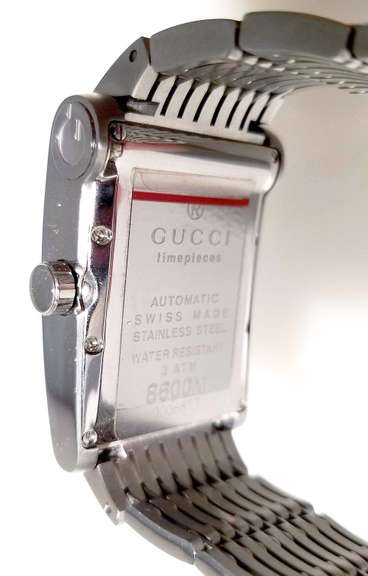 Gucci men's wristwatch 8600M Automatic Swiss Made NEW with tags box and papers