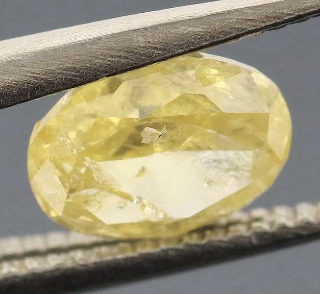 Rare .48ct oval cut yellow Diamond