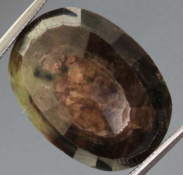 Shimmering metallic 15.85ct earth toned faceted Sapphire
