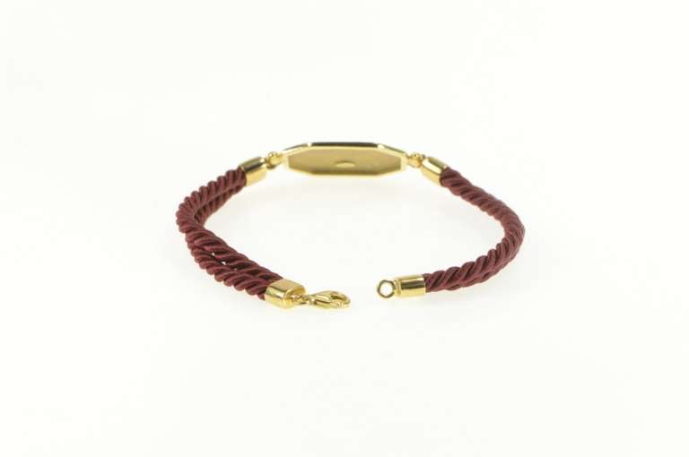 14K Yellow Gold Lion & Man Scene Burdick Co. Burgundy Cord Bracelet