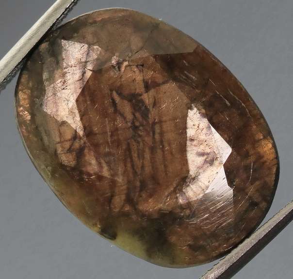 Shimmering metallic 15.85ct earth toned faceted Sapphire