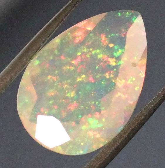 Wonderful glittering 1.98ct faceted Jelly Opal