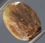 Golden shimmering 15.17ct earth toned faceted Sapphire
