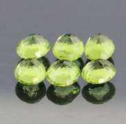Dazzling 6.78ct untreated apple green Peridot set