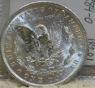 1884-O Morgan Dol near near Unc, strike thru