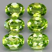 Dazzling 8.70ct untreated apple green Peridot set