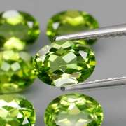 Dazzling 8.70ct untreated apple green Peridot set