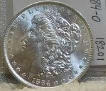 1884-O Morgan Dol near near Unc, strike thru