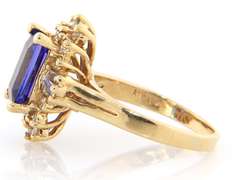 3.16ct Emerald Cut Tanzanite and 1.00ctw Diamond Starburst Yellow Gold Ring