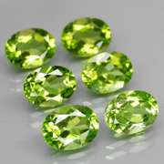 Dazzling 8.70ct untreated apple green Peridot set