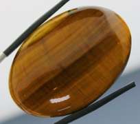 Full body shimmer! 75.44ct Golden Tiger Eye cabochon