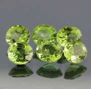 Dazzling 6.78ct untreated apple green Peridot set