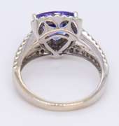 Powerful White Gold Trillion Cut Tanzanite and Diamond Halo Ring