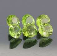 Dazzling 6.78ct untreated apple green Peridot set