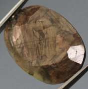 Shimmering metallic 15.85ct earth toned faceted Sapphire