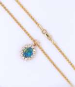 Pleasing Yellow Gold Oval Opal and Diamond Pendant on Wheat Chain