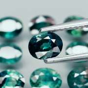 Heated only! 6.25ct blue green sapphire set