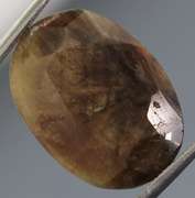 Golden shimmering 15.17ct earth toned faceted Sapphire