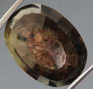 Shimmering metallic 15.85ct earth toned faceted Sapphire