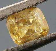 Glittering .20ct cushion cut golden yellow Diamond
