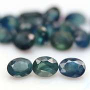 Heated only! 9.56ct blue green Sapphire set