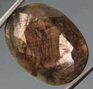 Shimmering metallic 15.85ct earth toned faceted Sapphire