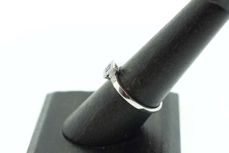 Regal Sole Sapphire 18k White Gold Ring Bordered with Diamonds
