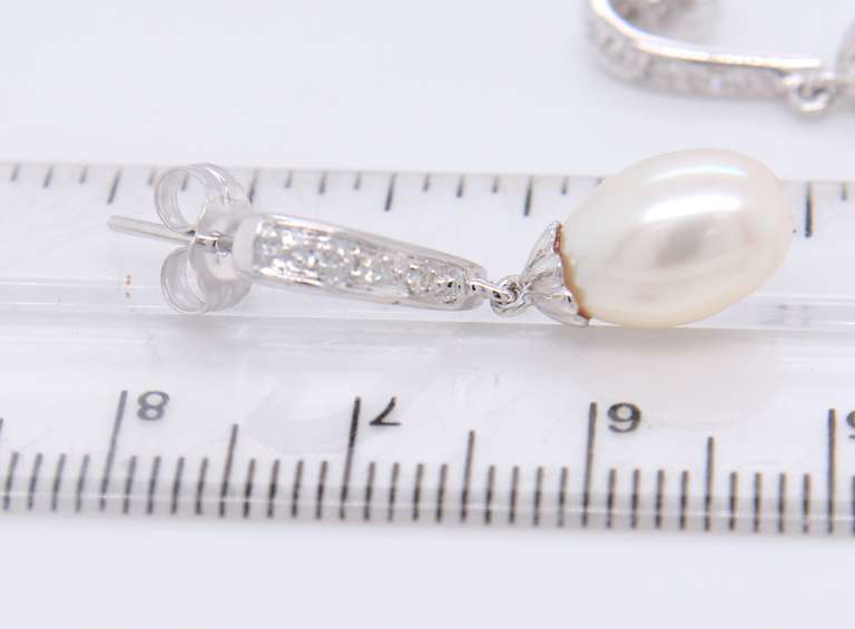 Charming White Gold Fresh Water Pearl and Diamond Dangle Earrings