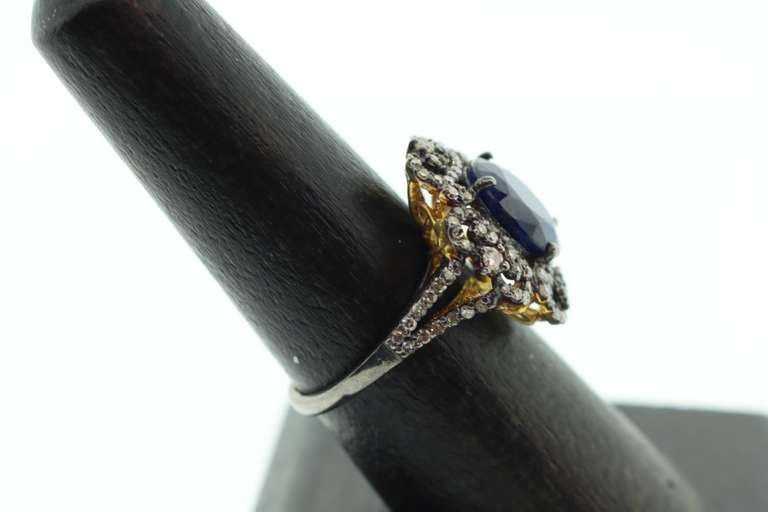 Impeccable Sapphire Ring with Intricate Diamond Studs on top Gold Plated Silver